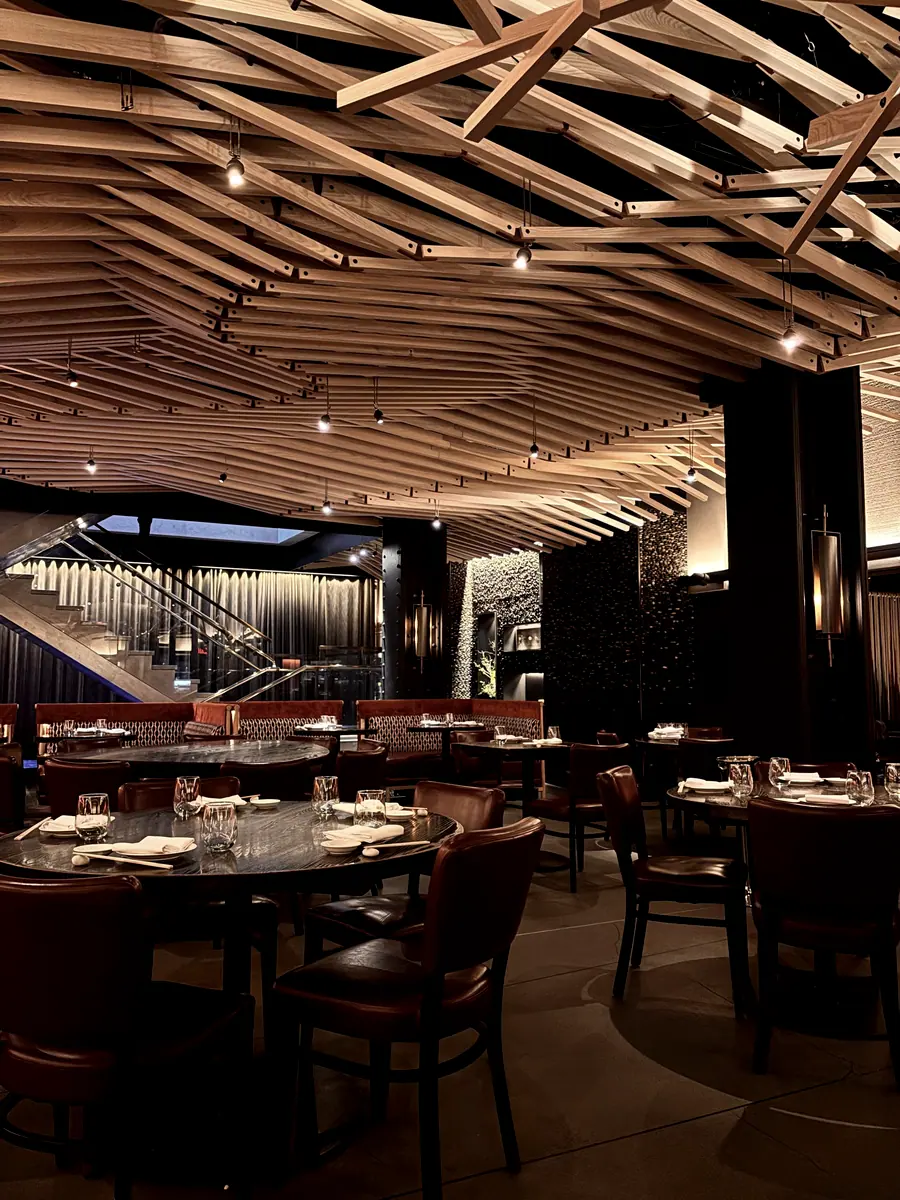 Bar and dining room under a slatted timber ceiling