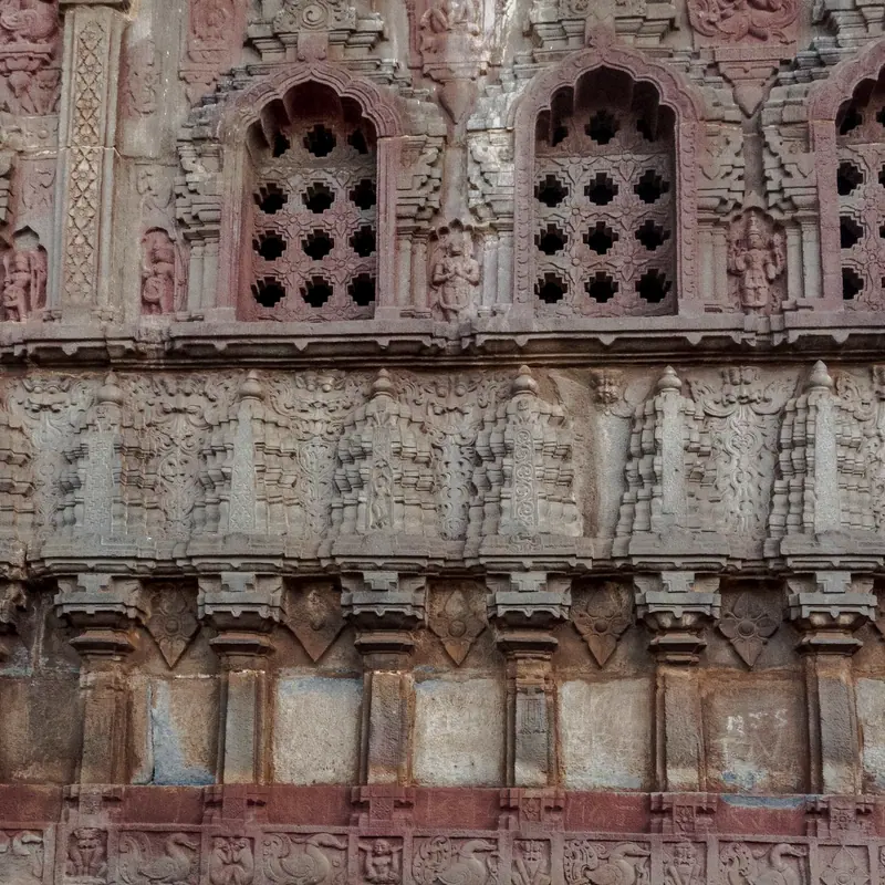 Carved niches set into a dressed sandstone wall